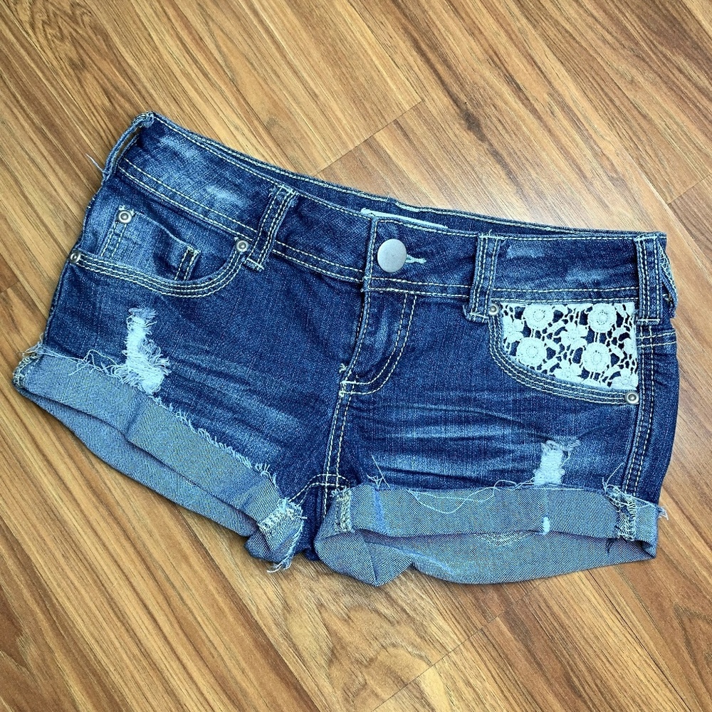 Empyre jean cut off shorts with crochet pockets
